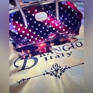 BRANGIO Italy, burgundy purse.